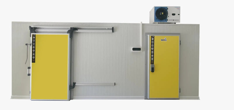 Cold room panel wall with a yellow sliding door, a hinged door and a condensing unit on top, shown on a white background
